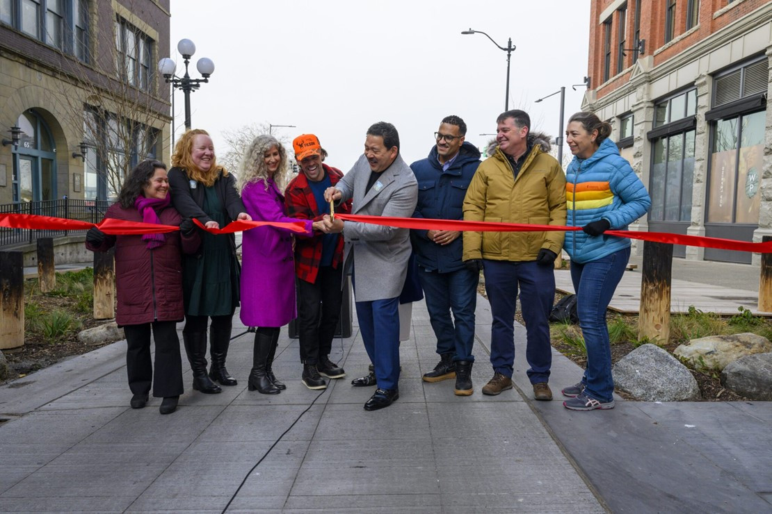 Ribbon-cutting ceremony for Pioneer Square East-West Improvements Project in Pioneer Square South, celebrating project completion with community leaders.