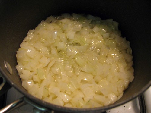 Sautéing diced onions in butter in a pan for Pioneer Woman Tomato Soup
