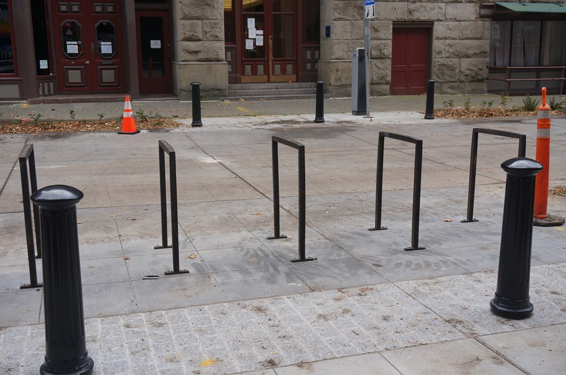 Image of new bike racks installed on S Main St in Pioneer Square South, promoting cycling and sustainable transportation.