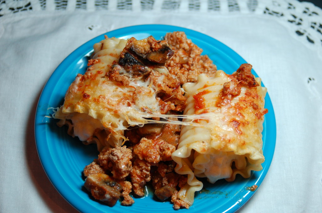 Individual lasagna roll-ups in foil pans ready for the freezer