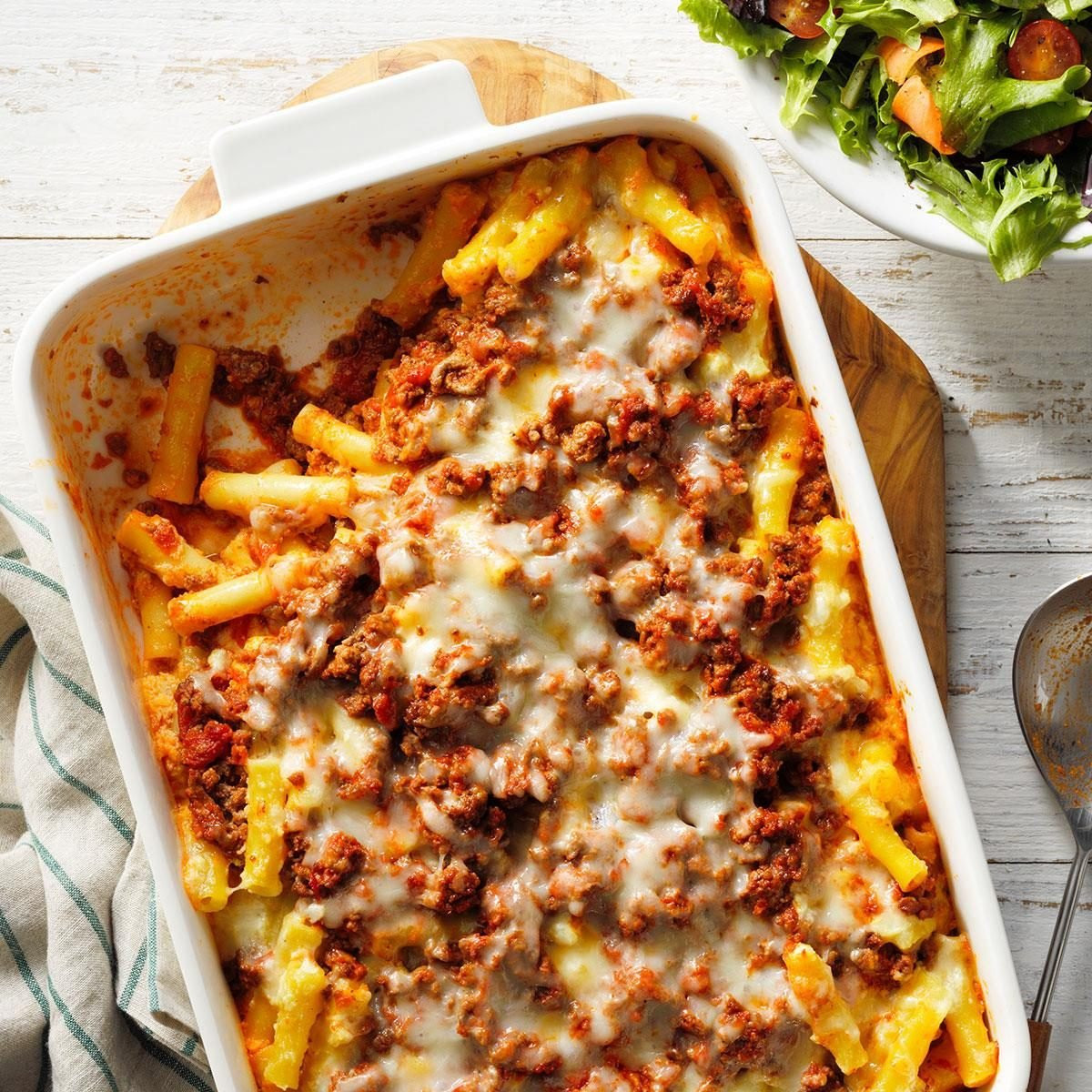 Baked Ziti, a cheesy baked ziti dish with visible layers of pasta and sauce in a baking dish.