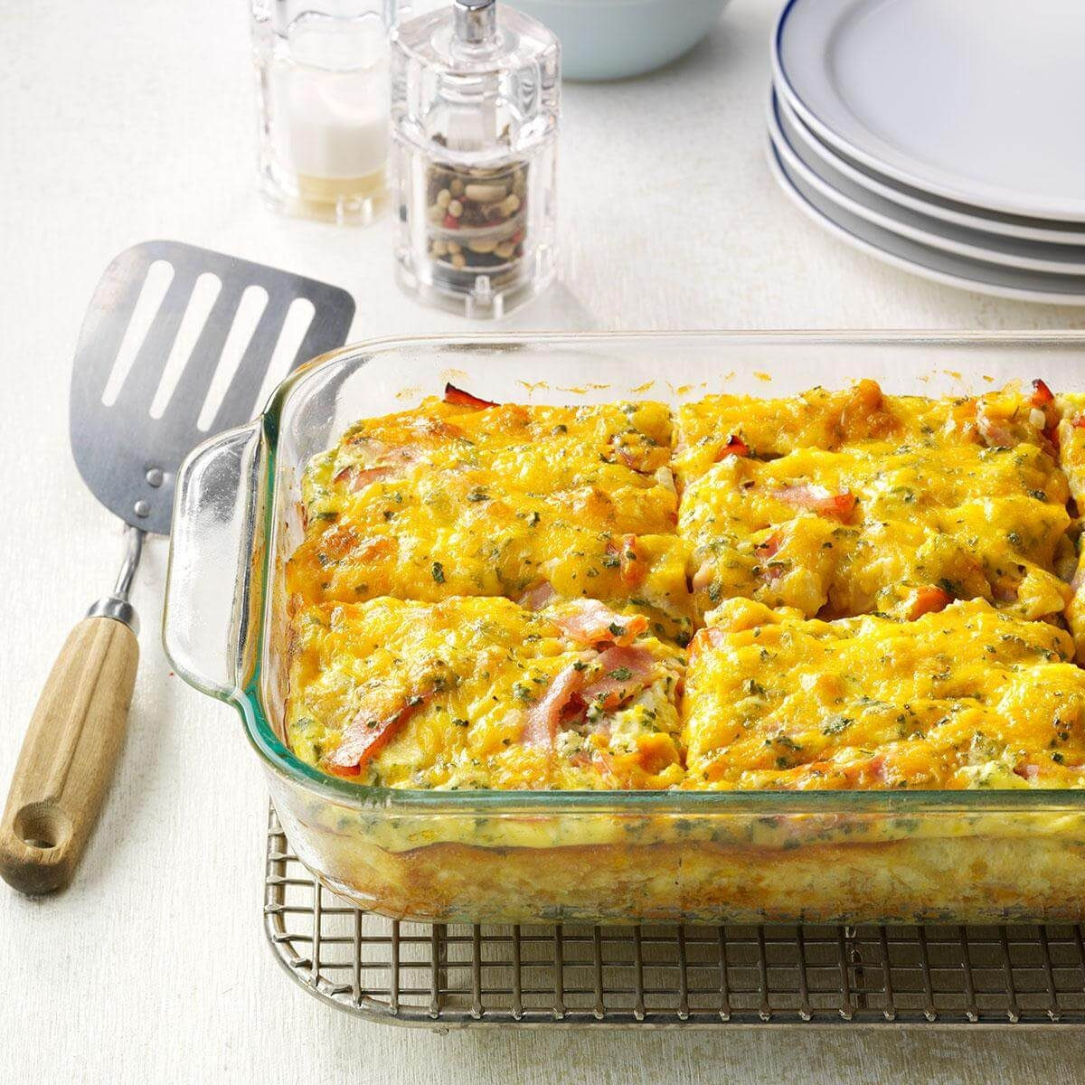 Loaded Tater Tot Bake, a Pioneer Woman inspired breakfast casserole, served on a white plate.