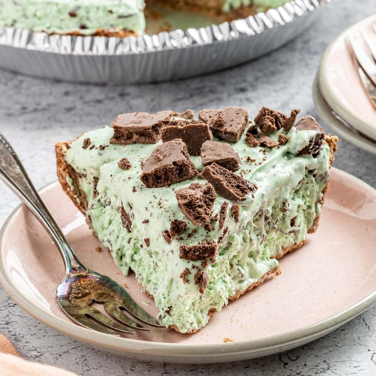 Grasshopper Pie, a sliced grasshopper pie showing the green minty filling and chocolate crust.