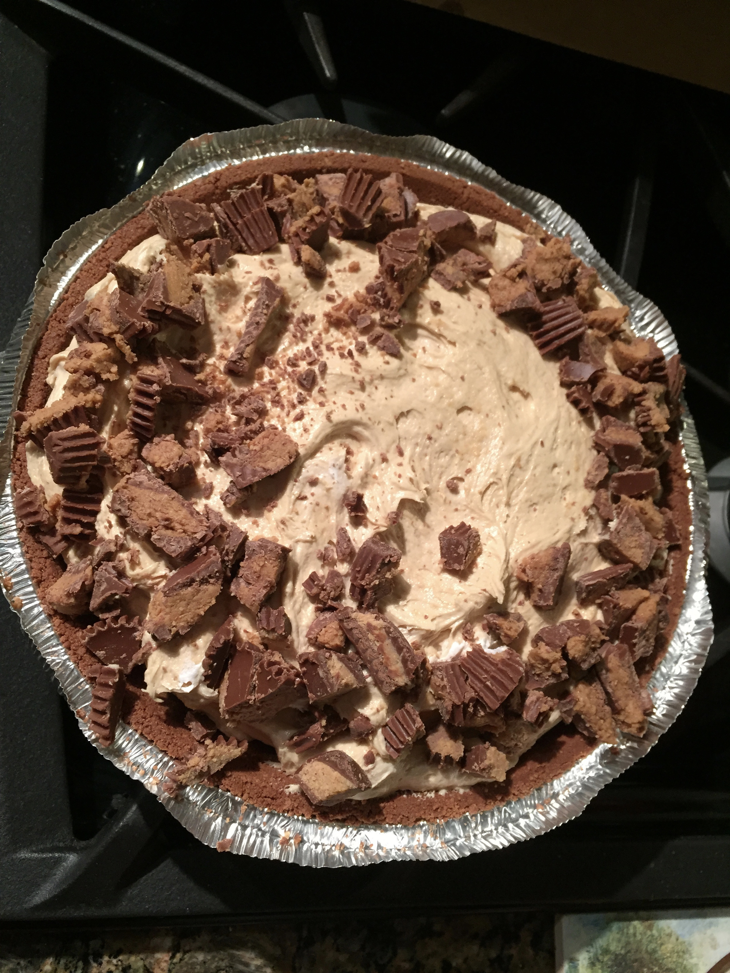 Close-up of a peanut butter pie slice with whipped topping