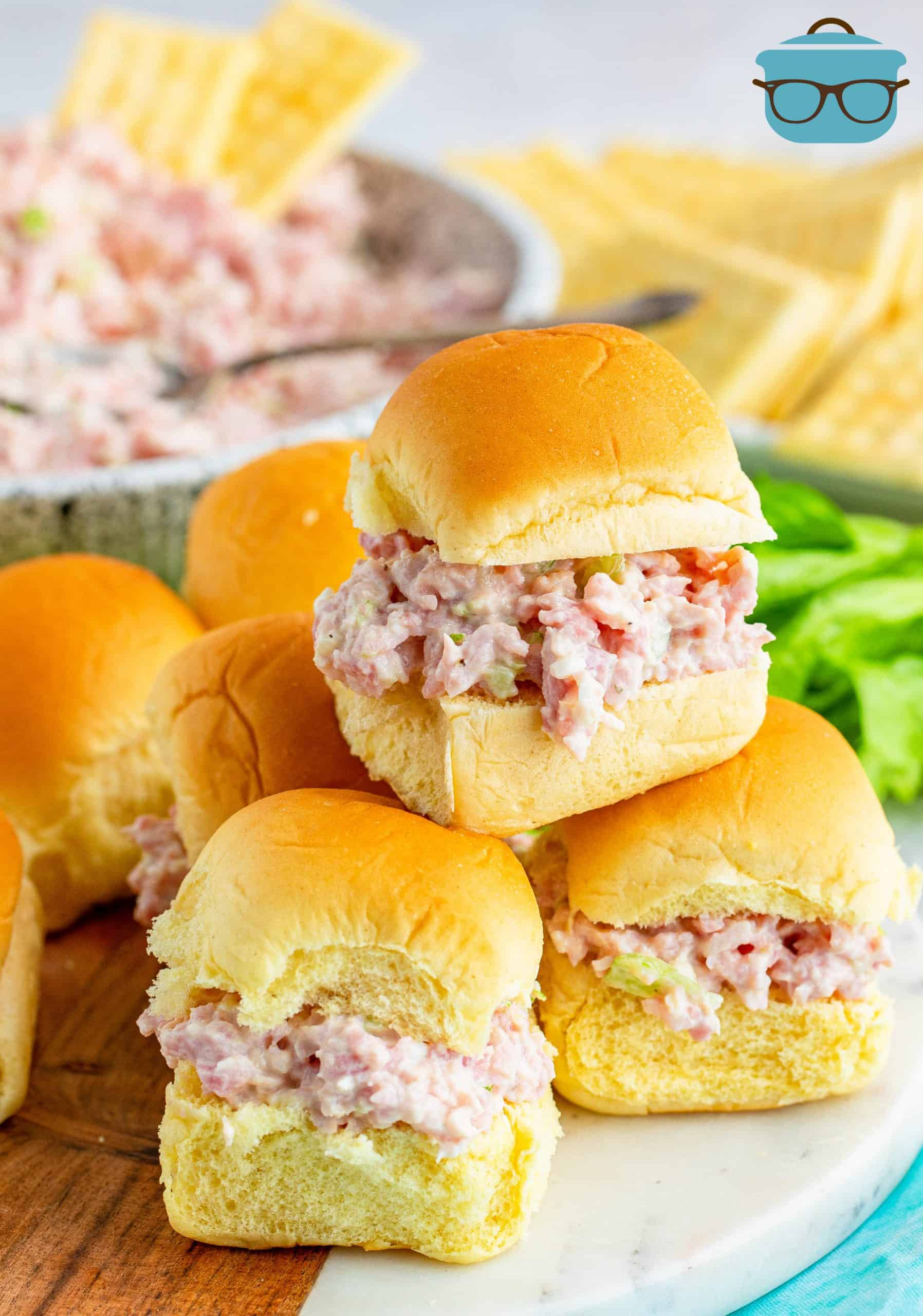 ham salad shown on Hawaiian Sweet Rolls stacked on a plate