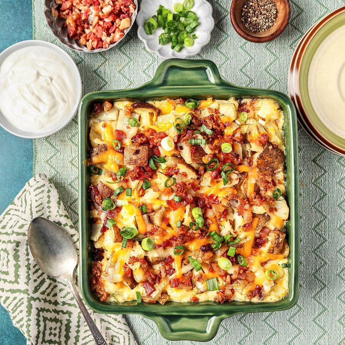 Twice-Baked Potato Casserole, a creamy potato casserole with bacon and cheese in a baking dish.