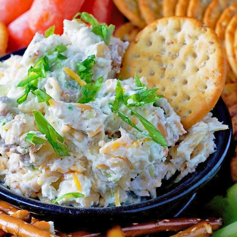 Pioneer Woman Million Dollar Dip, a creamy cheese dip with vegetables and pretzels.