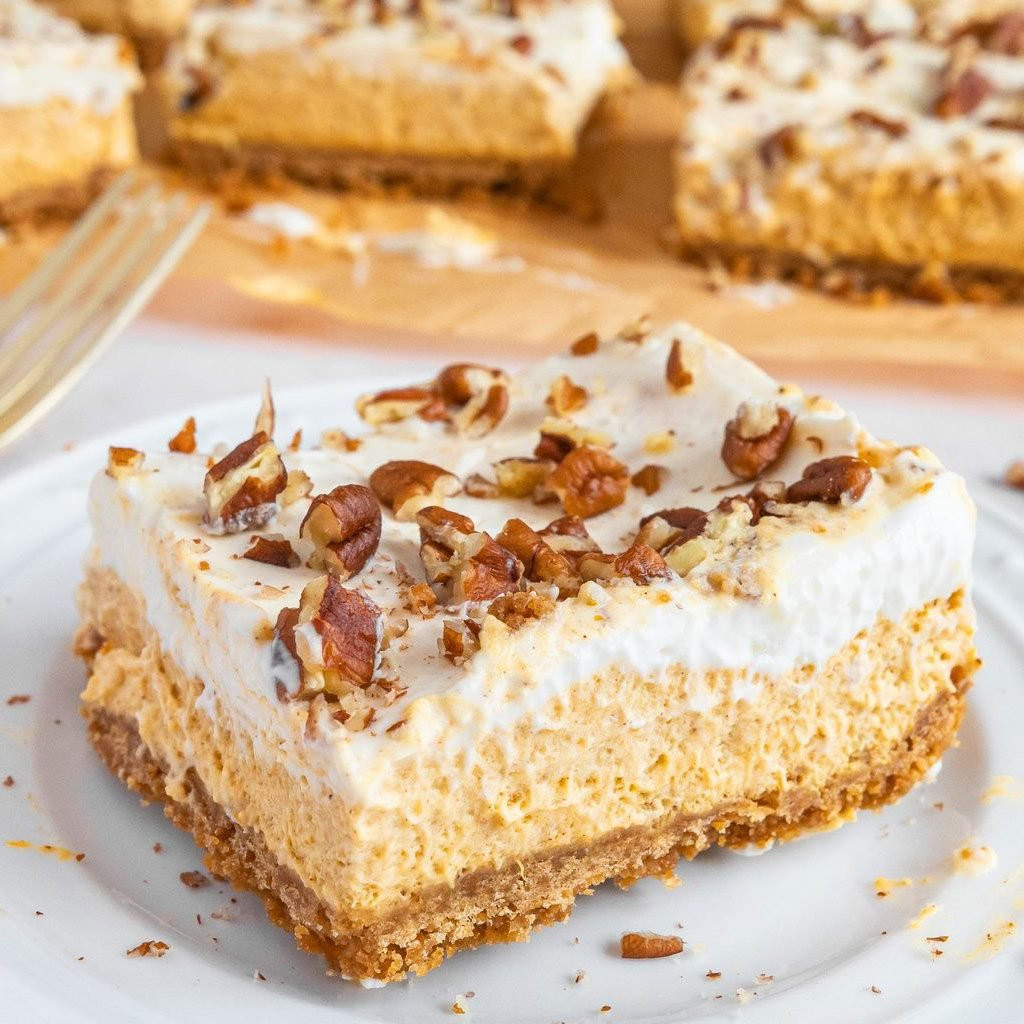 Pioneer Woman Pumpkin Bars, showing pumpkin bars with cream cheese frosting, cut into squares.