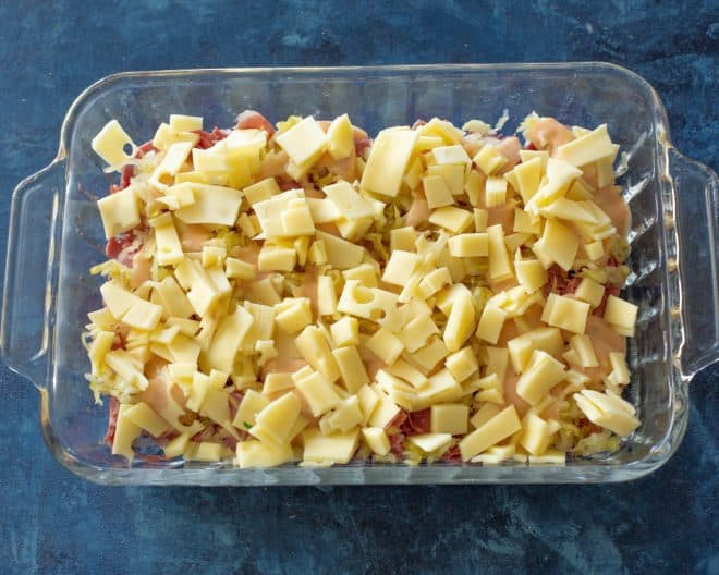 Melted Swiss cheese topping on a Reuben Casserole, showcasing the cheesy goodness