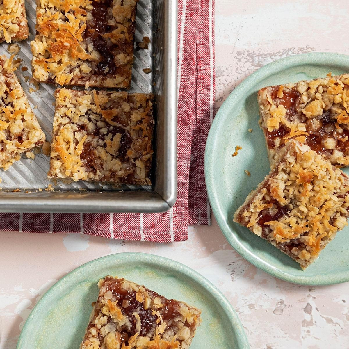 Strawberry Oatmeal Bars, showing strawberry oatmeal bars cut into squares, revealing a strawberry filling.