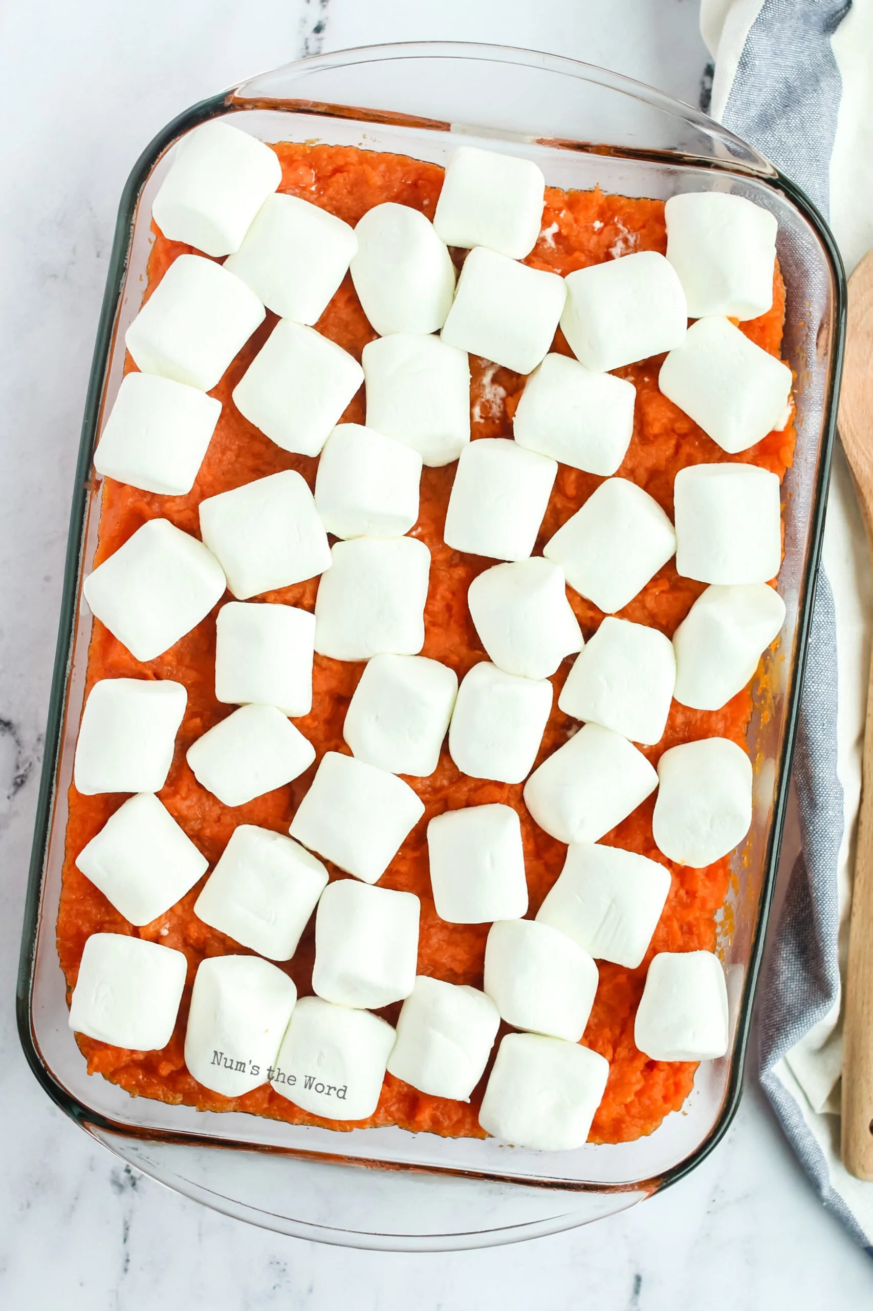 Large marshmallows topping uncooked Pioneer Woman Sweet Potato Casserole before baking