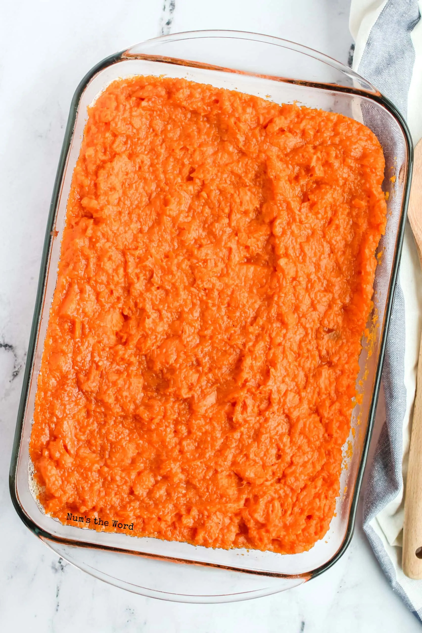 Mashed sweet potato mixture ready to be baked in a casserole dish for Pioneer Woman Sweet Potato Casserole