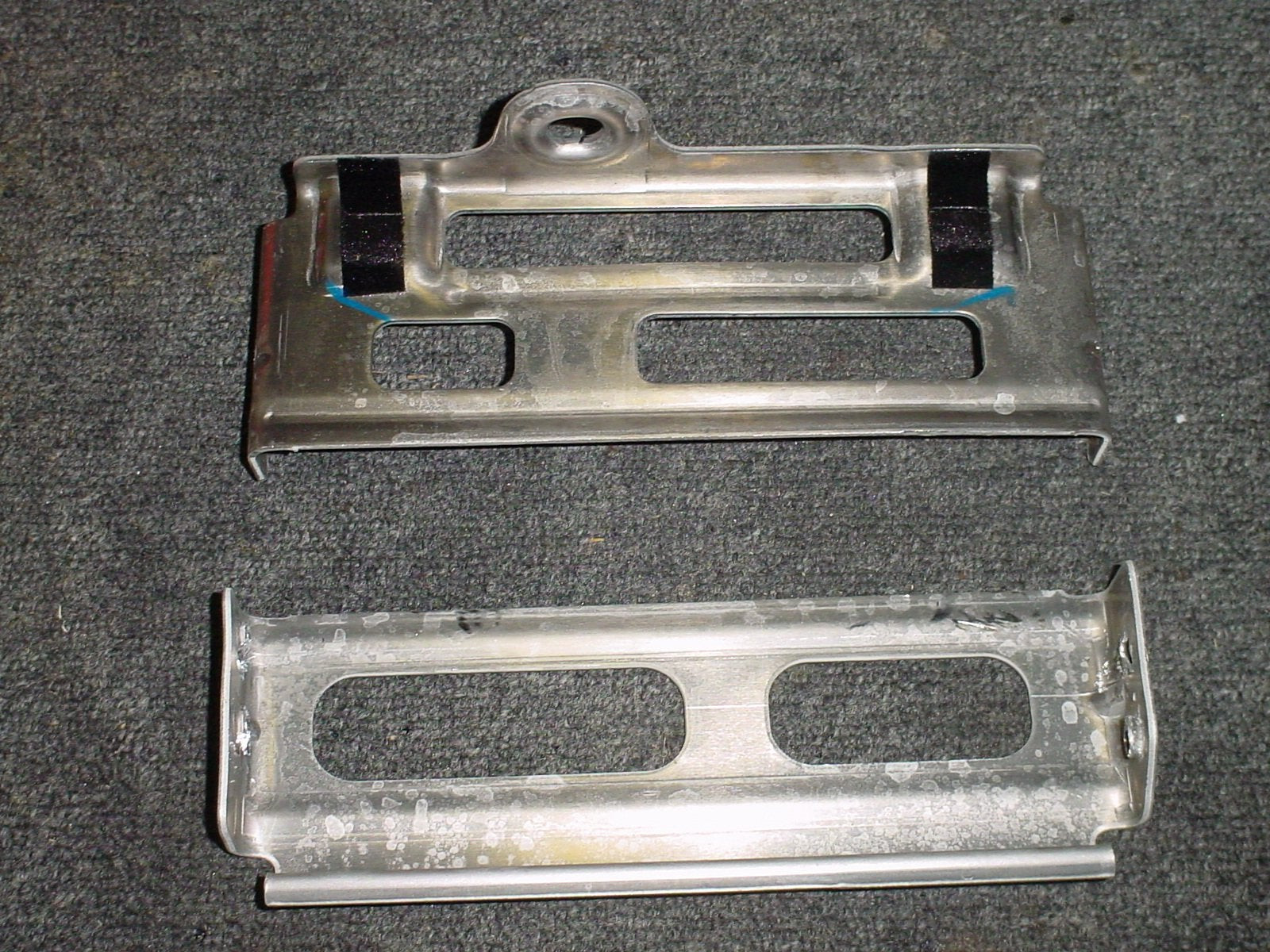 Close-up of the Corvette's metal radio brackets that need to be removed for a double DIN installation