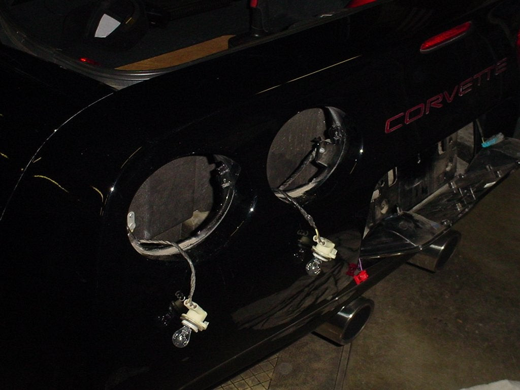 GPS antenna mounted on the Corvette's rear bumper brace, showing a discreet location for GPS receiver installation