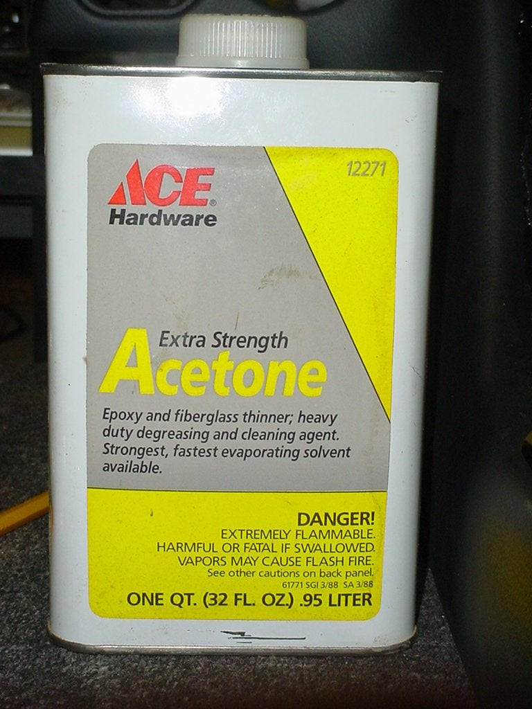 Acetone in a container being used to create ABS slurry for console modification, showing materials used for plastic repair