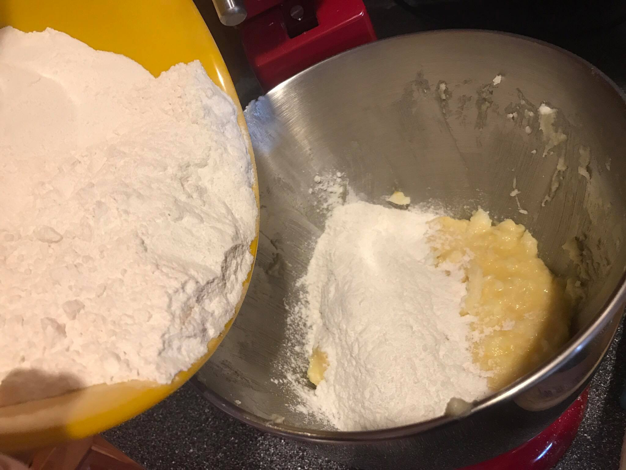 Mixing dry and wet ingredients until just combined for sugar cookie dough