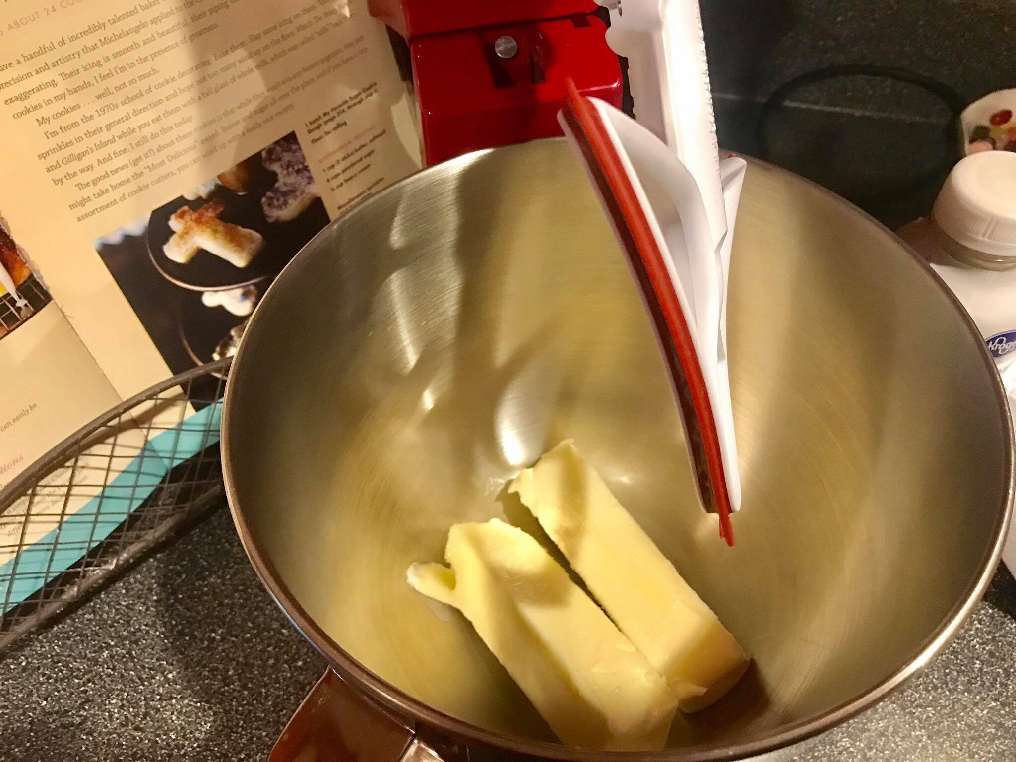 Softened butter in a mixing bowl for buttercream frosting