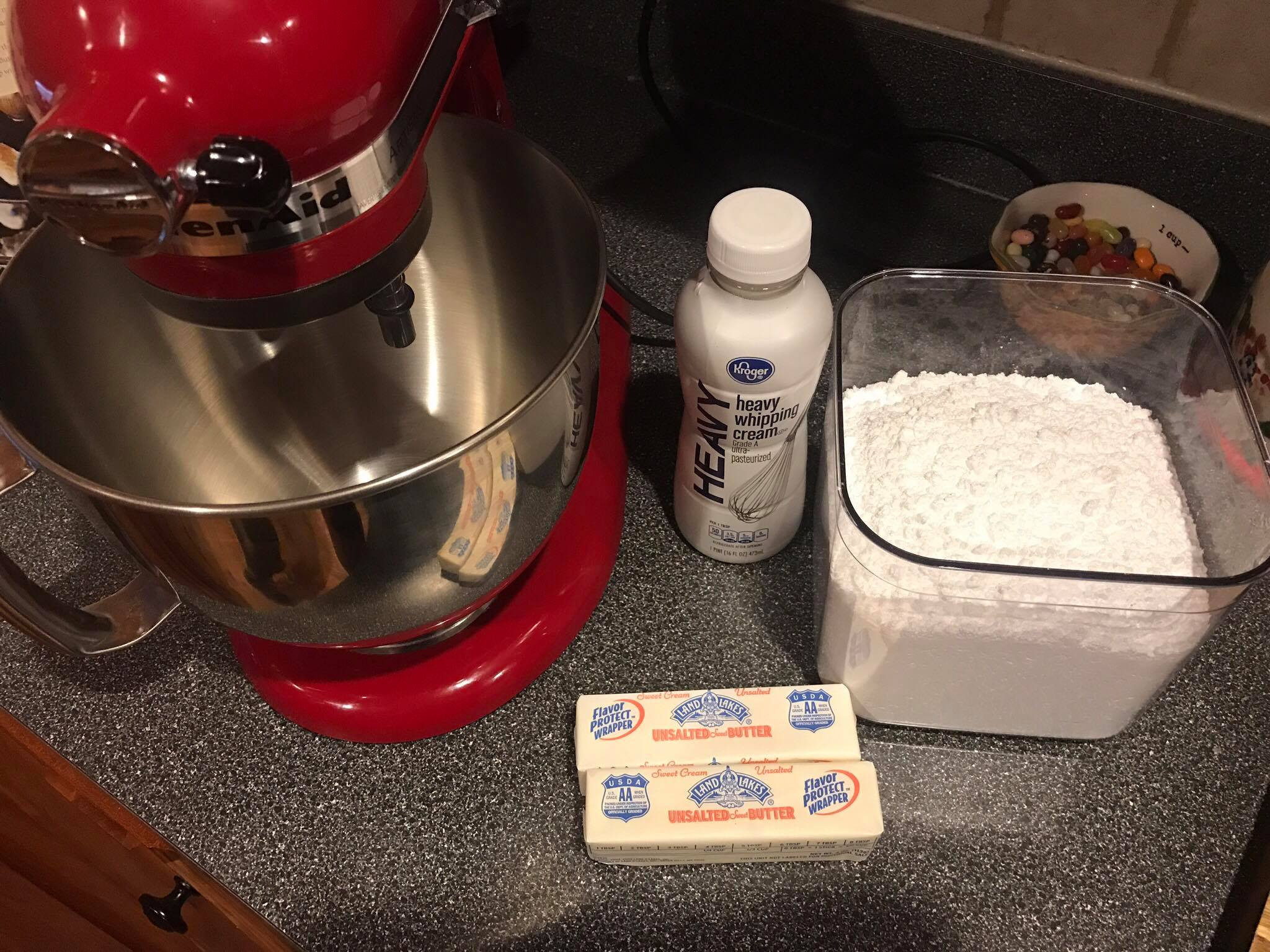 Empty mixing bowl being cleaned in preparation for making buttercream frosting