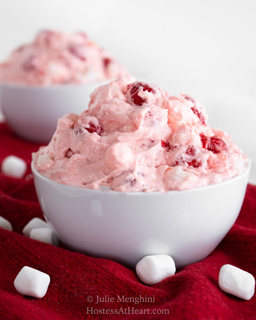 Close up side view of Pineapple Cherry Fluff with another bowl in the background