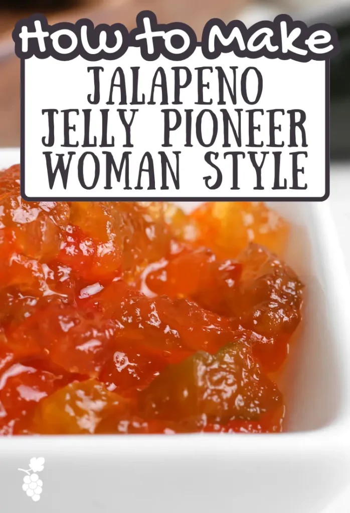 Close-up shot of homemade jalapeno jelly in a glass jar, showcasing its vibrant green color and thick, glossy texture.