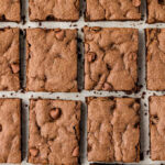 Rows of rich chocolate cake mix bars, showcasing the fudgy texture.