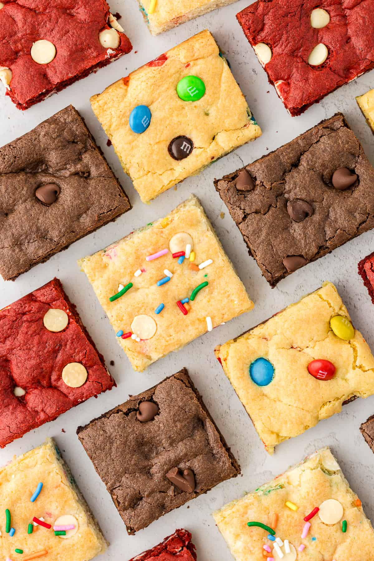 Variety of cake mix bar flavors, including chocolate, red velvet, funfetti, and M&amp;M.
