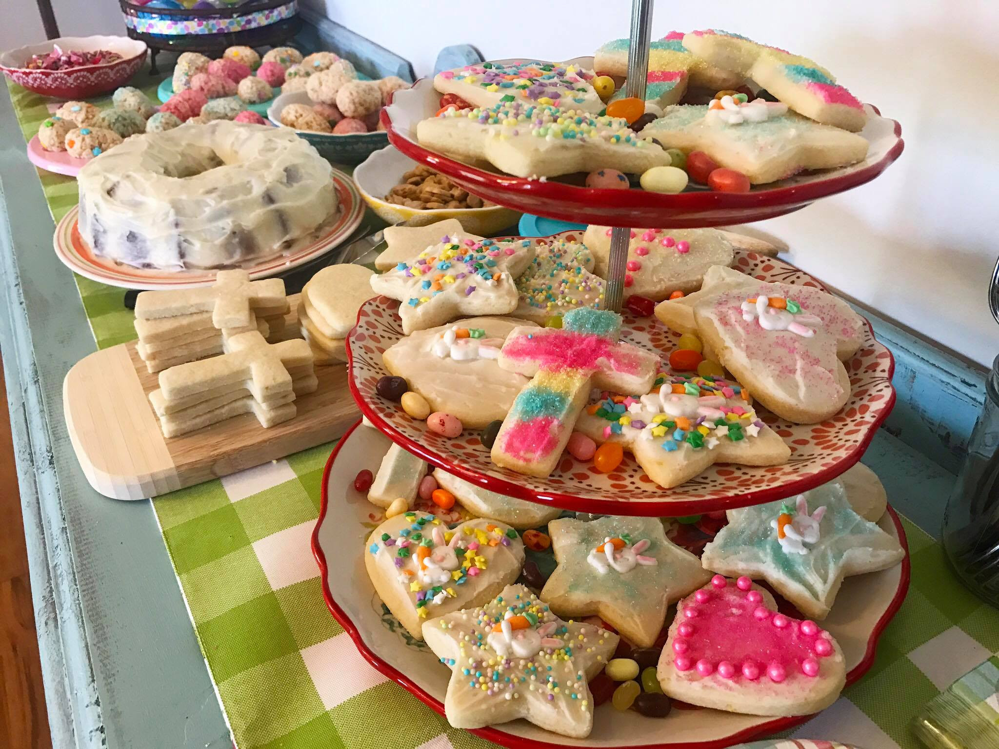 Sugar cookies and carrot cake on a dessert table