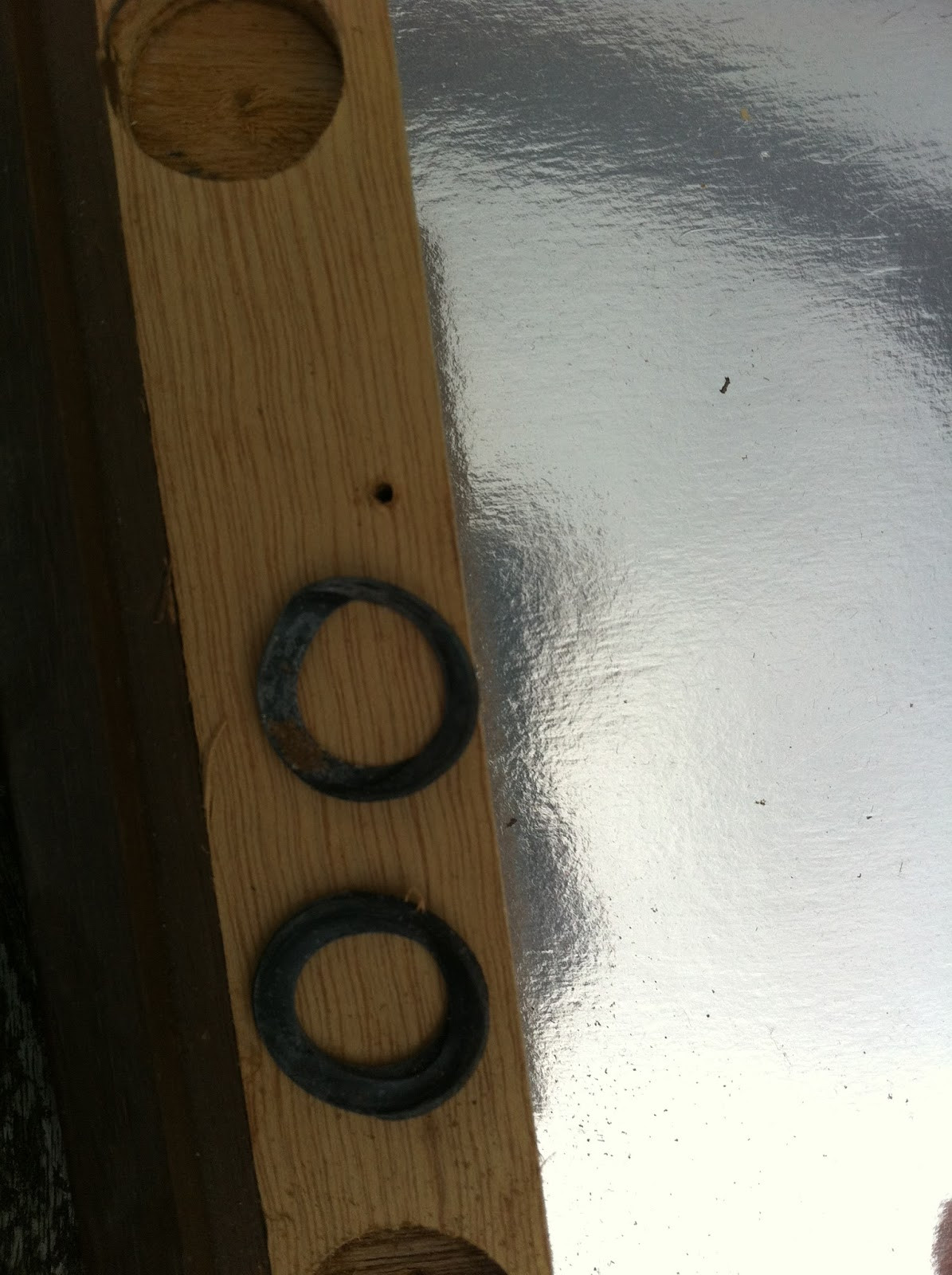 Close-up of Pioneer PL-12D spring recess with rubber washers, detailing their placement.