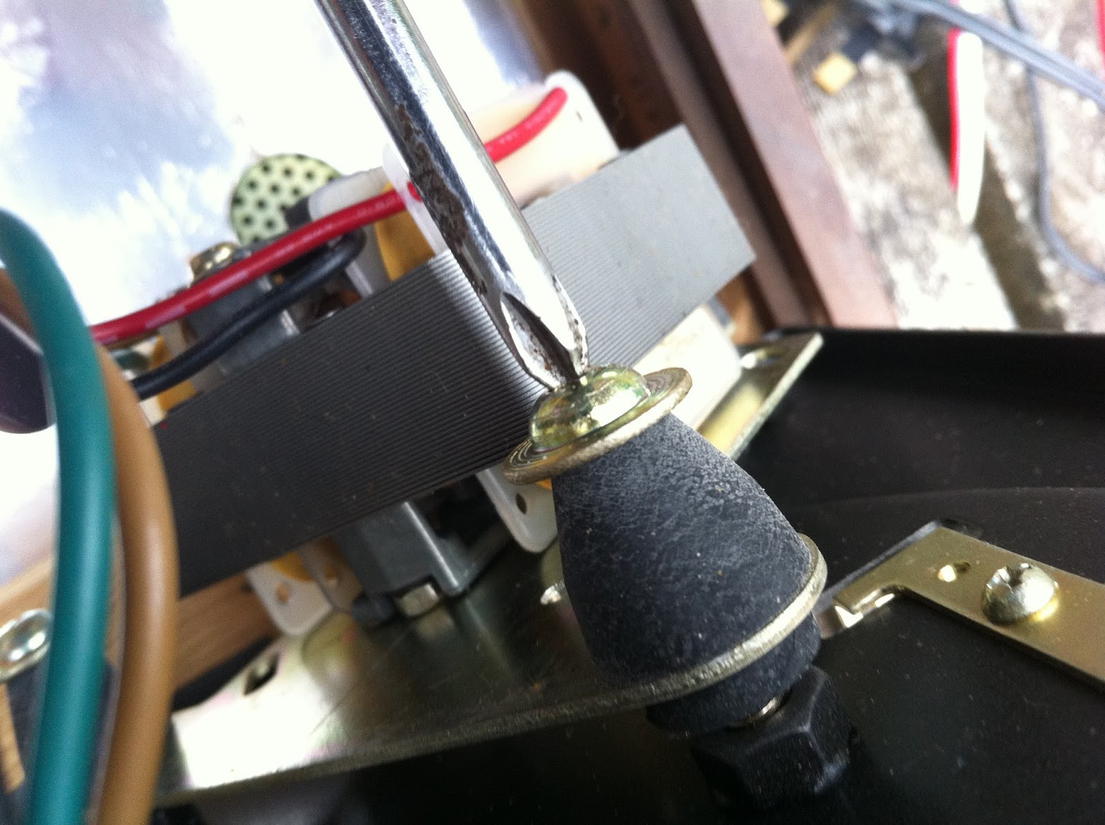Inverted view of Pioneer PL-12D motor mounting, highlighting the rubber bushes and threaded rods.