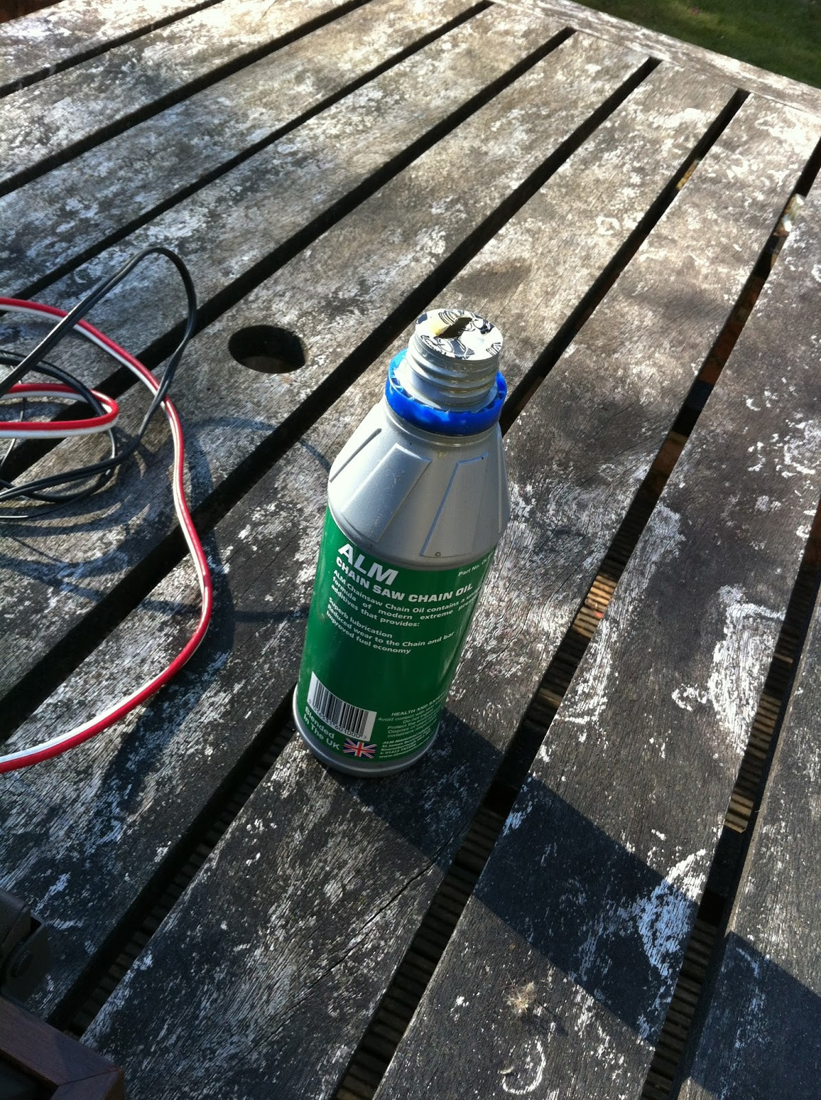 Pioneer PL-12D spindle being re-lubricated with oil before reinsertion into the bearing well.
