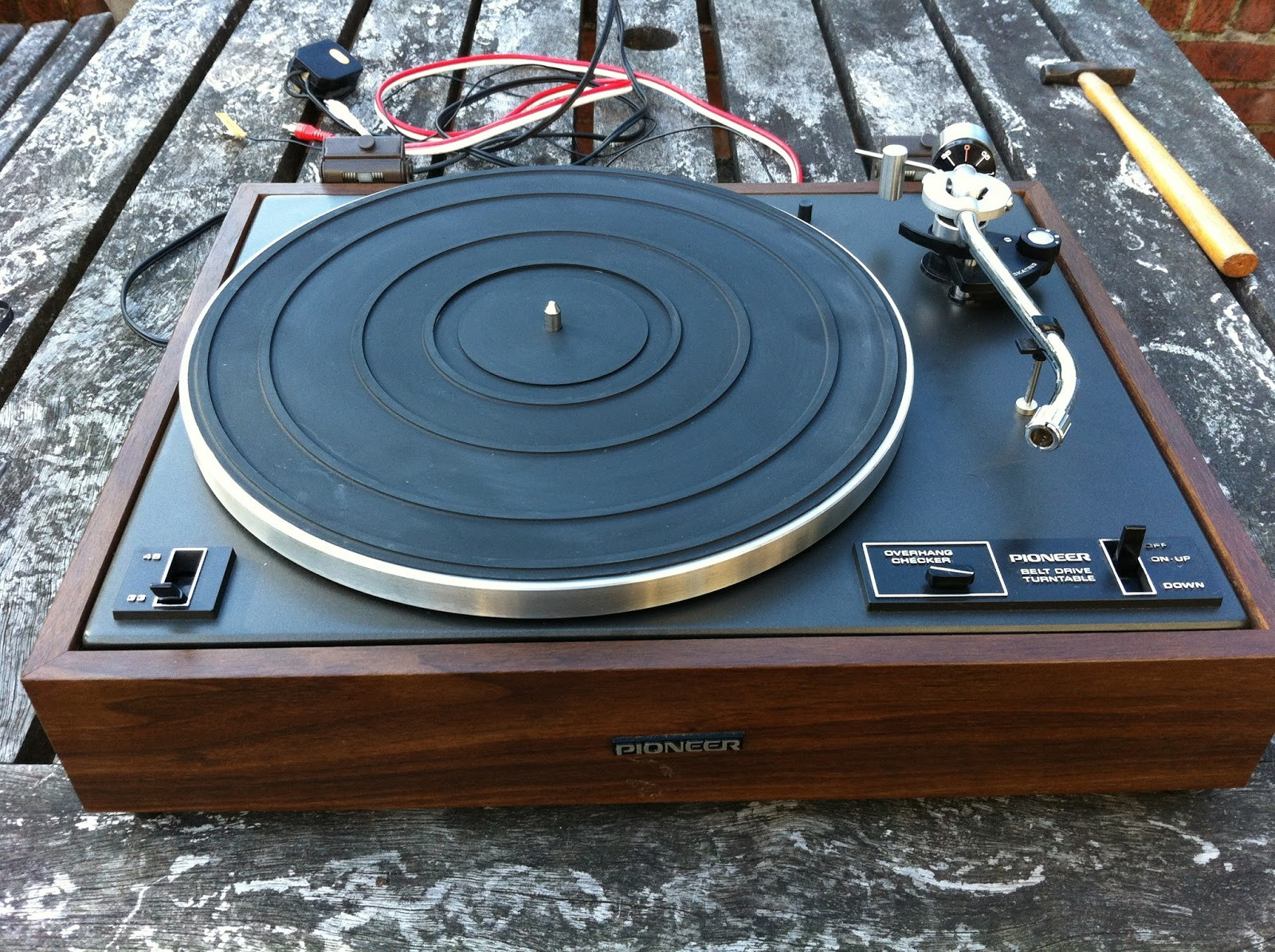 Pioneer PL-12D main bearing reassembled, showing smooth spindle rotation after lubrication.