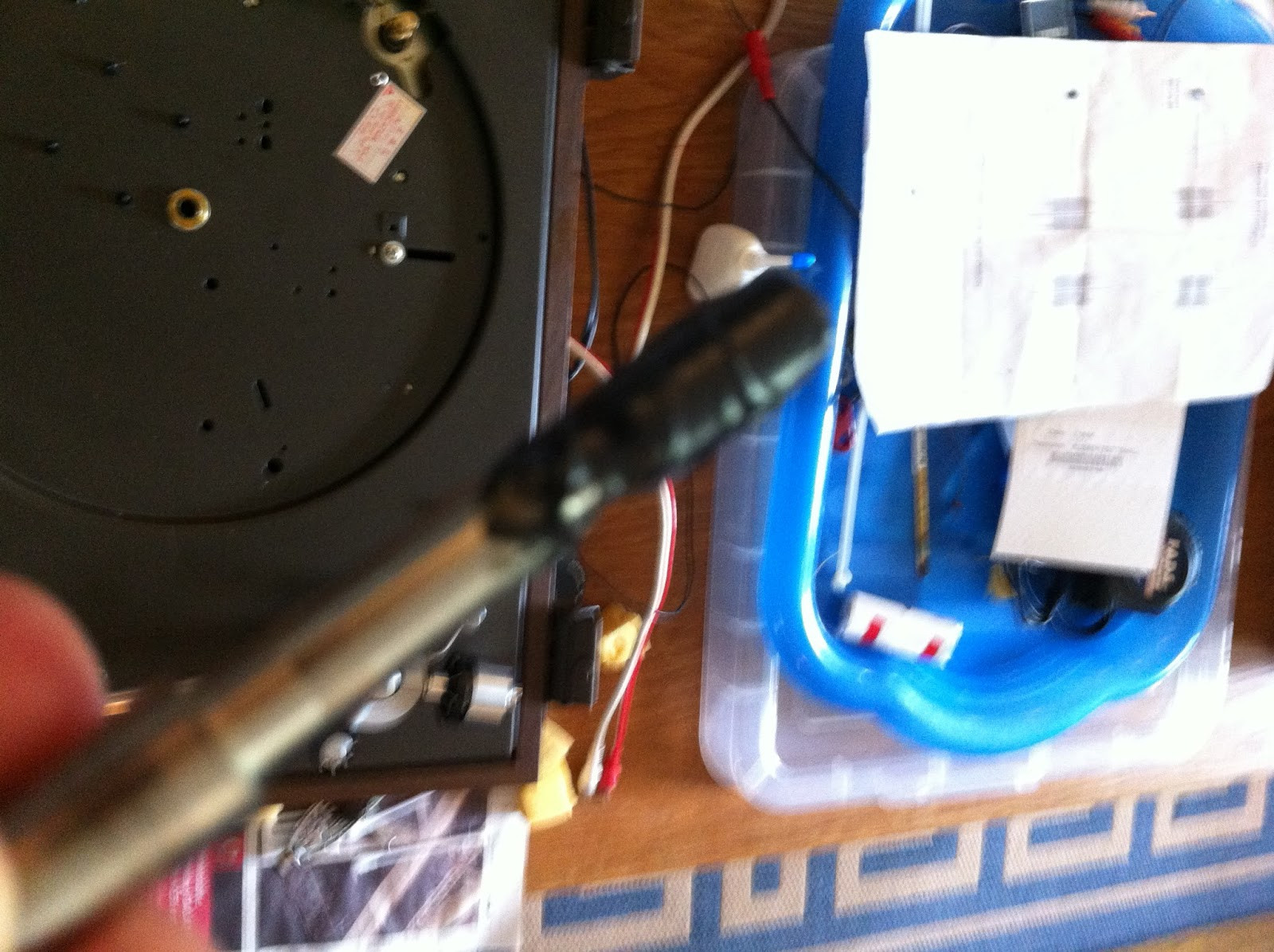 Close-up of strobe disc under filament light, showing lines for pitch adjustment and verification.