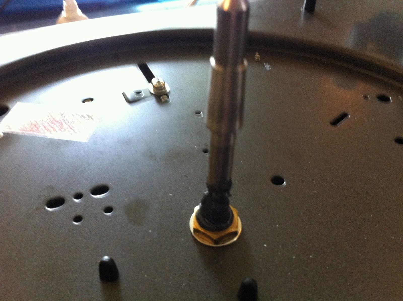 Application of oil to the Pioneer PL-12D motor oil point for lubrication and noise reduction.