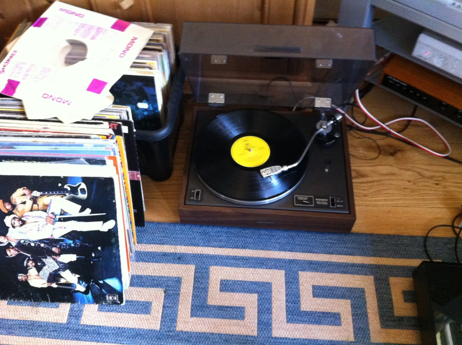 Tonearm azimuth check on Pioneer PL-12D, ensuring vertical cartridge alignment for optimal stereo separation.