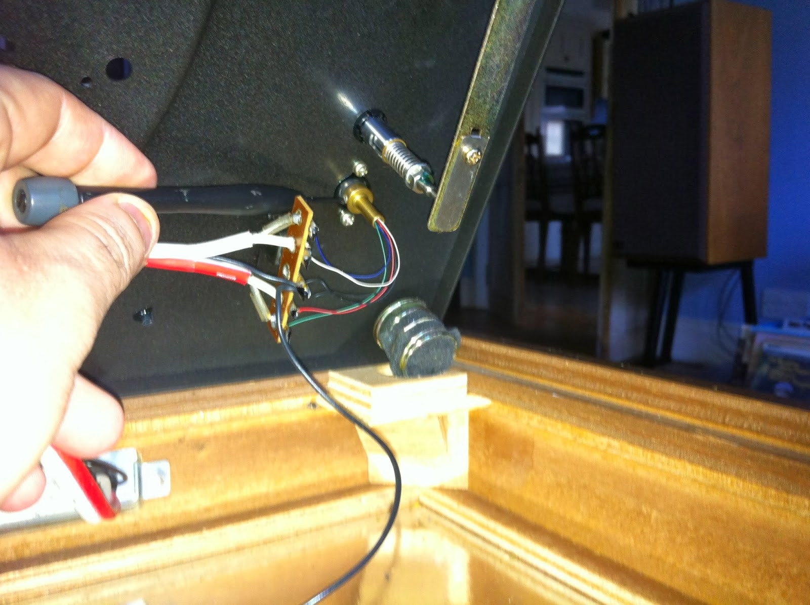 Close-up of Pioneer PL-12D tonearm bearing collar and locking screw, highlighting adjustment point.