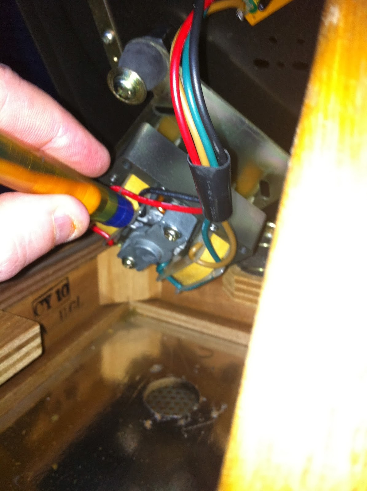 Precision oiler applying lubricant to Pioneer PL-12D motor spindle for lower bearing access.