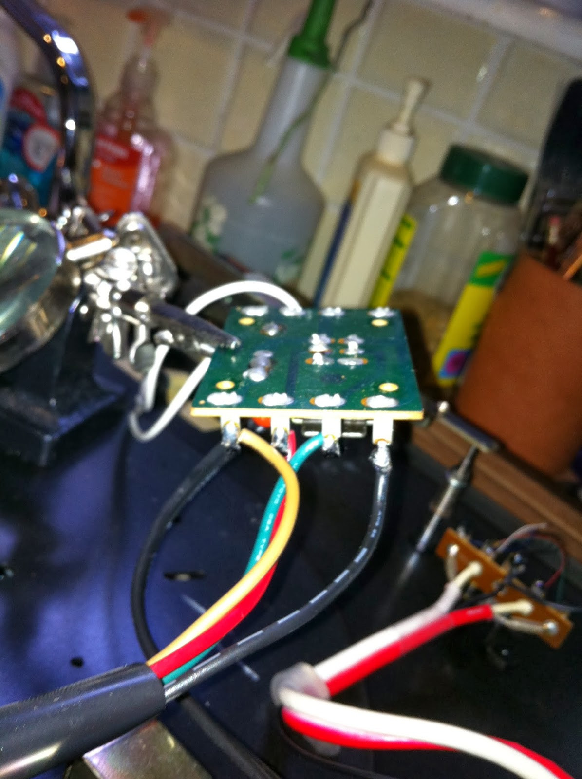 Close-up of Pioneer PL-12D motor circuit board and wire connection tabs, ready for desoldering.