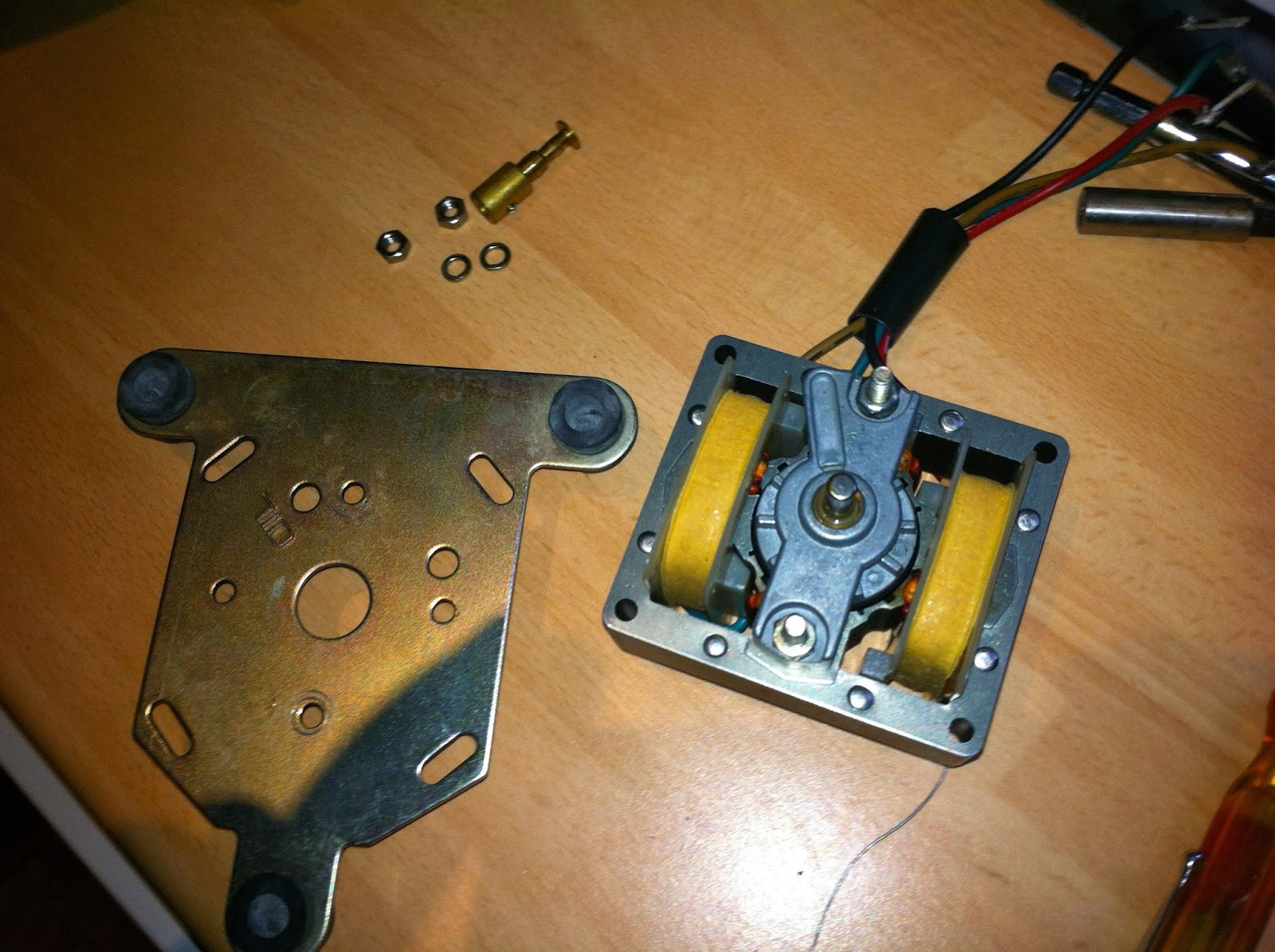 Pioneer PL-12D motor mounting plate, spindle, and hardware removed, preparing for motor frame separation.