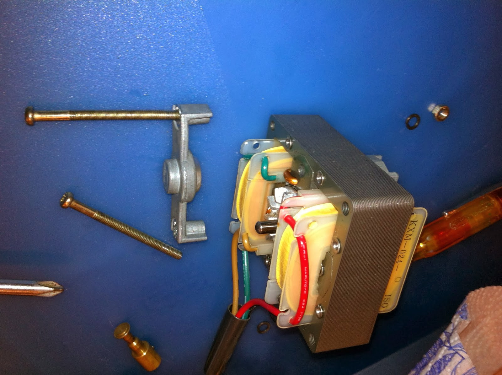 Pioneer PL-12D motor bolts being removed, separating motor frame for bearing access.