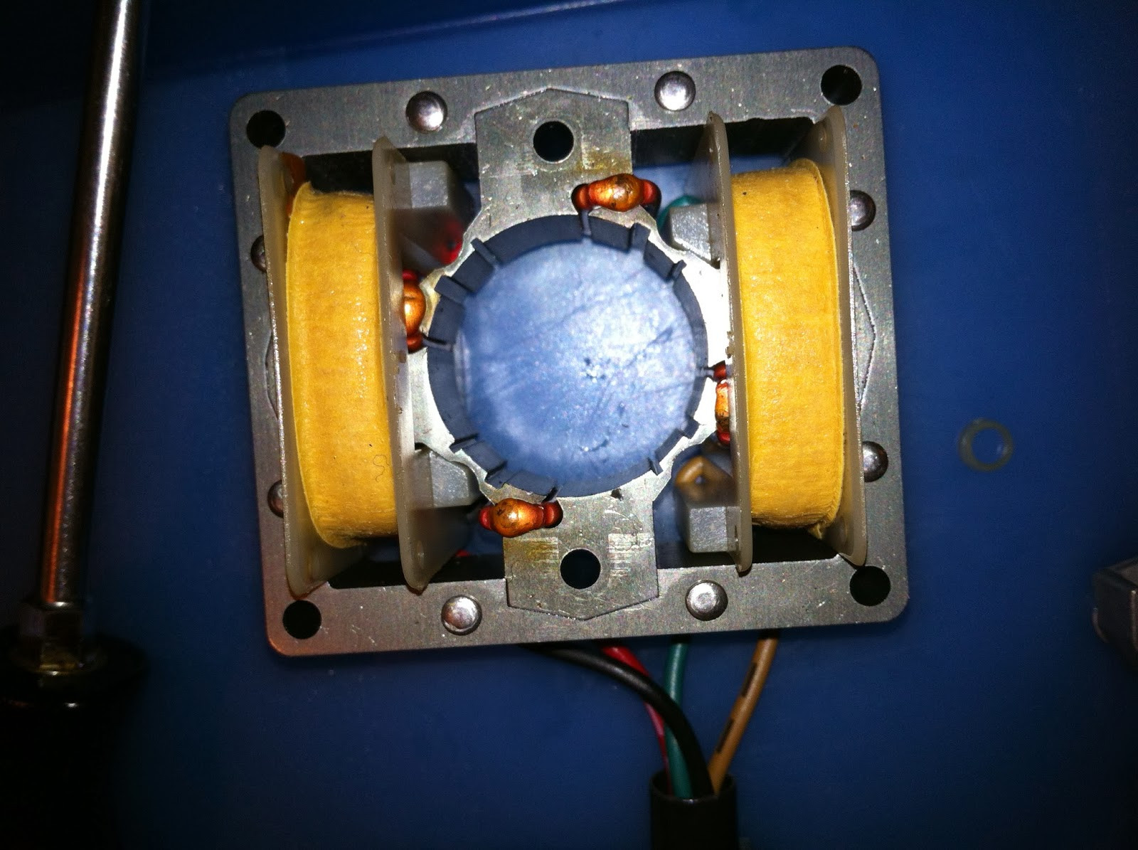 Pioneer PL-12D motor spindle plastic washer, removed and stored for reassembly.