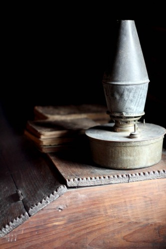 A vintage lantern, a detail of pioneer-era lighting and the atmosphere of Hart Square