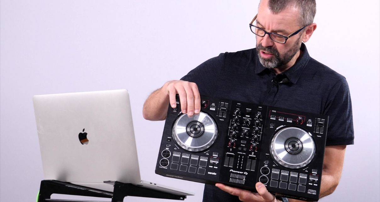 Angle shot of the DDJ-REV1 performance pads section, emphasizing their functionality within a compact controller layout.