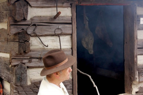 Smoked hams in a smokehouse, demonstrating pioneer methods of food preservation at the NC village