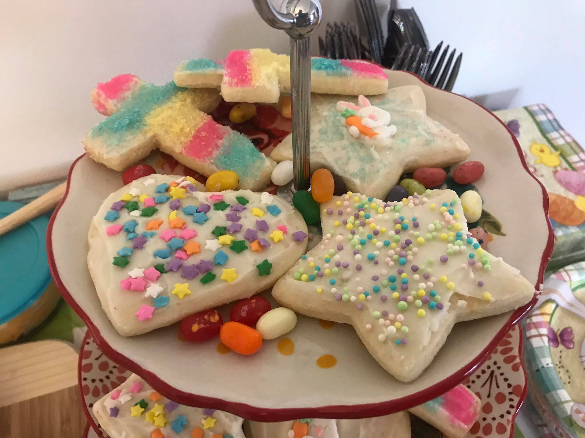 Three-tier serving tray with decorated sugar cookies