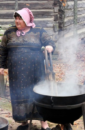 Traditional clothes washing demonstration, highlighting the daily chores of pioneer life