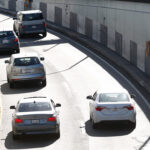 Cars driving under a license plate recognition camera