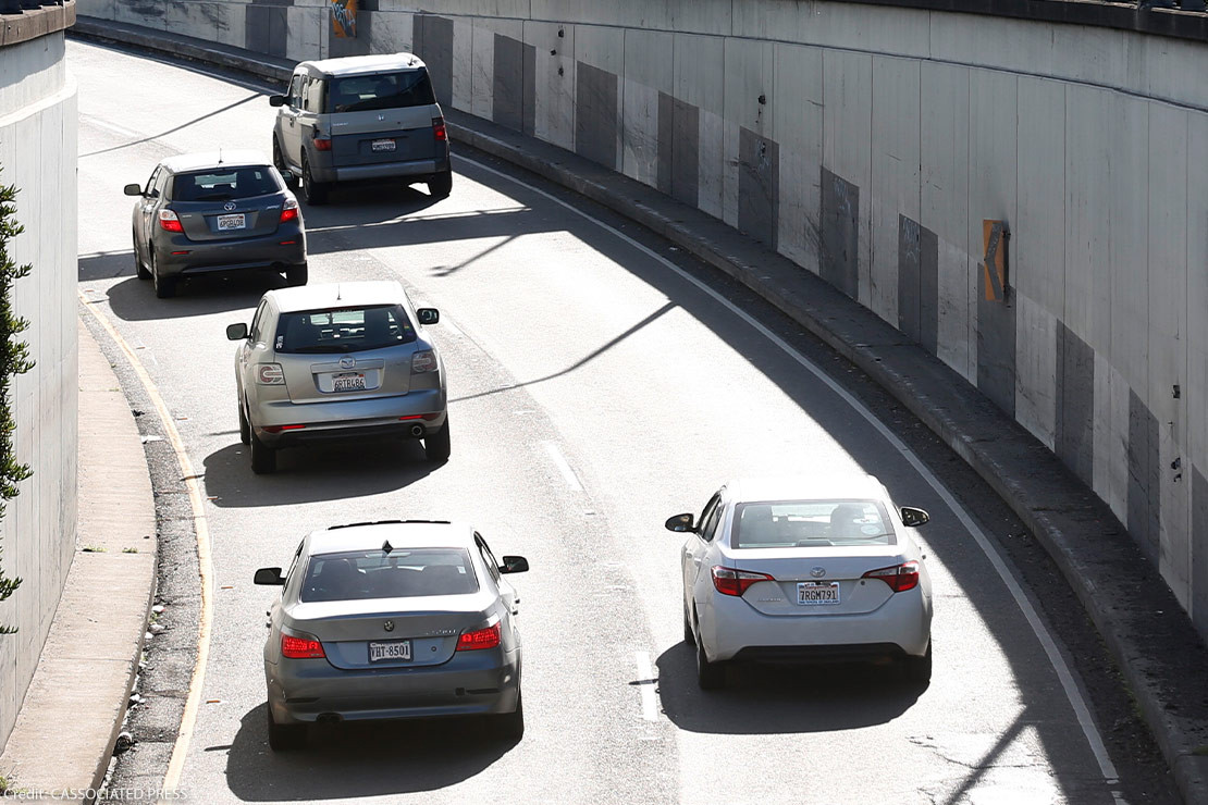 Cars driving under a license plate recognition camera